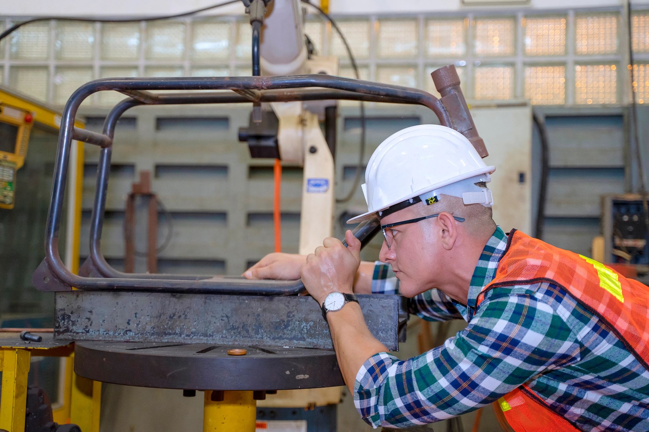 Industrial worker in safety gear performing inspection work